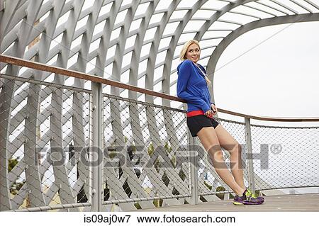 Woman resting against fence, Tongva Park, Santa Monica, California, USA View Large Photo Image Stock Photo - Woman resting against fence, Tongva Park, Santa Monica, California, USA. Fotosearch