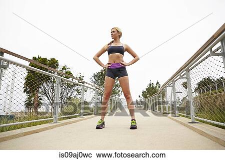 Woman standing on bridge View Large Photo Image Stock Image - Woman standing on bridge. Fotosearch
