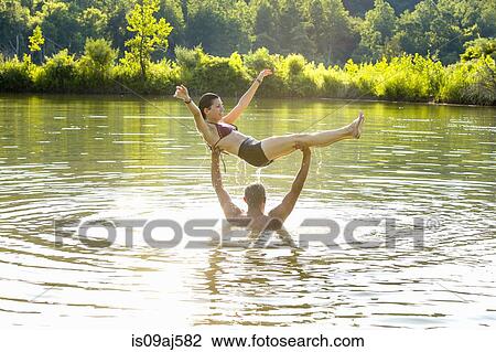 Young couple fooling around in canal, Delaware Canal State Park, New Hope, Pennsylvania, USA View Large Photo Image Stock Image - Young couple fooling around in canal, Delaware Canal State Park, New Hope, Pennsylvania, USA. Fotosearch