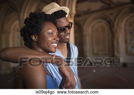 Young couple strolling in Bethesda Terrace arcade, Central Park, New York City, USA View Large Photo Image Picture - Young couple strolling in Bethesda Terrace arcade, Central Park, New York City, USA. Fotosearch