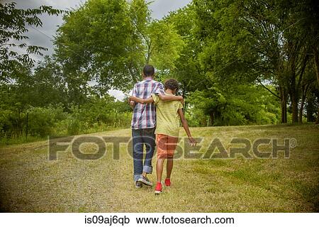 Stock Image - Boys in a forest. Fotosearch