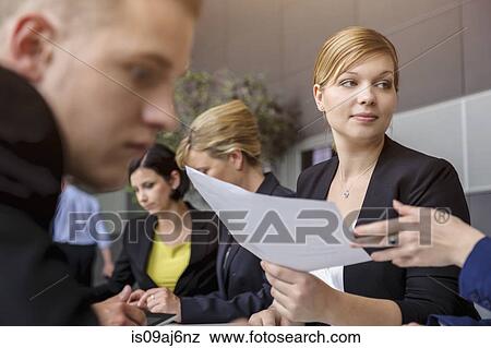 Stock Photo - Business colleagues at ideas meeting. Fotosearch