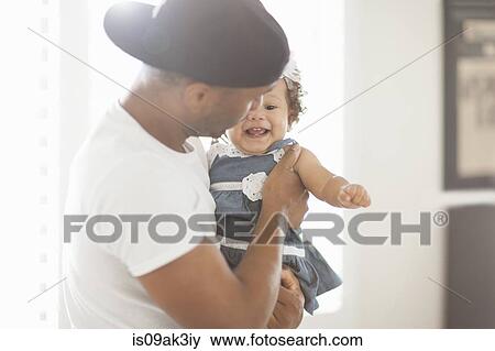 Stock Photo - Father playing with young daughter. Fotosearch