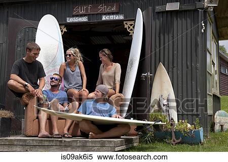Five young adult surfer friends chatting outside shed View Large Photo Image Stock Photography - Five young adult surfer friends chatting outside shed. Fotosearch