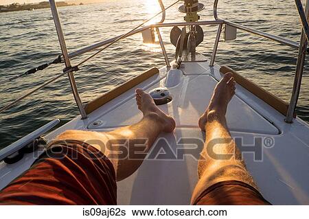 Man's legs and feet on yacht View Large Photo Image Stock Photograph - Man's legs and feet on yacht. Fotosearch
