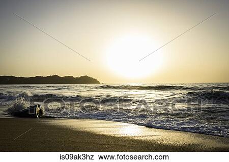 Ocean waves and sand at sunset View Large Photo Image Stock Photo - Ocean waves and sand at sunset. Fotosearch