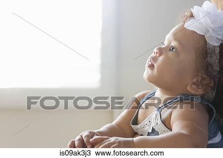Stock Image - Portrait of baby girl. Fotosearch
