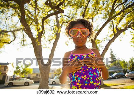 Portrait of girl in scuba goggles in garden View Large Photo Image Stock Image - Portrait of girl in scuba goggles in garden. Fotosearch