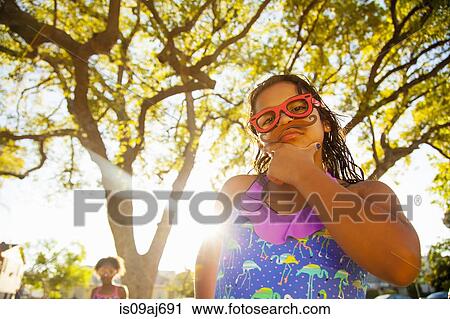 Portrait of girl in spectacles and mustache in garden View Large Photo Image Stock Image - Portrait of girl in spectacles and mustache in garden. Fotosearch