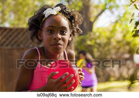 Portrait of girl with water balloon View Large Photo Image Stock Photography - Portrait of girl with water balloon. Fotosearch