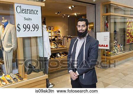 Portrait of tailor and shop window of men's clothes shop View Large Photo Image Picture - Portrait of tailor and shop window of men's clothes shop. Fotosearch