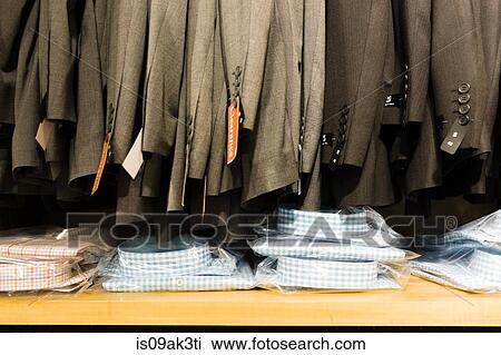 Row of sale suit jackets in men's clothes shop View Large Photo Image Stock Image - Row of sale suit jackets in men's clothes shop. Fotosearch