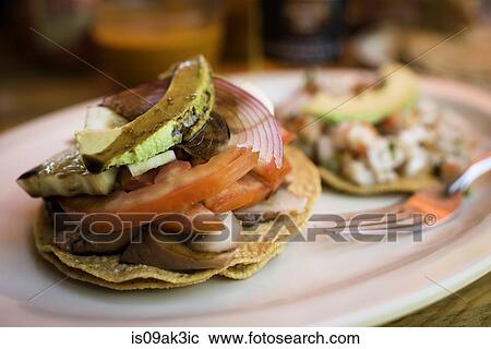 Stock Image - Seafood (conch) tostada, close up. Fotosearch