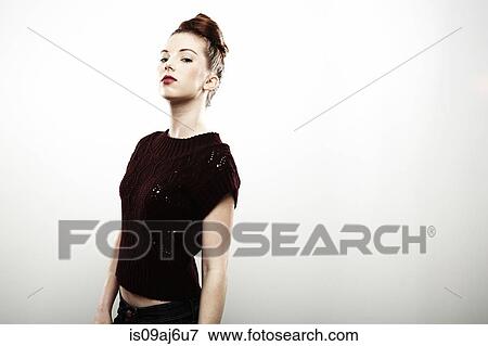 Stock Photo - Studio portrait of aloof young woman. Fotosearch