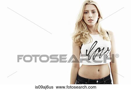 Stock Photograph - Studio portrait of young woman staring at camera. Fotosearch