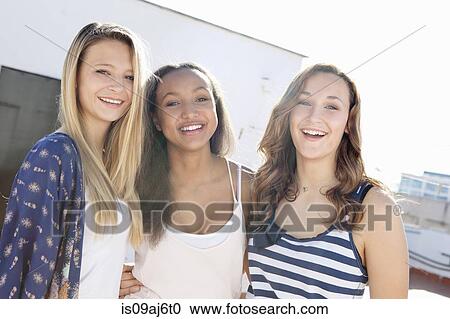Stock Image - Teenage girls laughing. Fotosearch