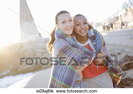 Teenage girls wrapped in blanket, monument in background, Palma, Mallorca, Spain View Large Photo Image Stock Image - Teenage girls wrapped in blanket, monument in background, Palma, Mallorca, Spain. Fotosearch