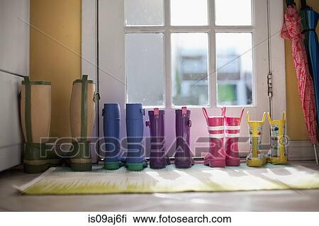 Tidy row of rubber boots at back door View Large Photo Image Stock Image - Tidy row of rubber boots at back door. Fotosearch