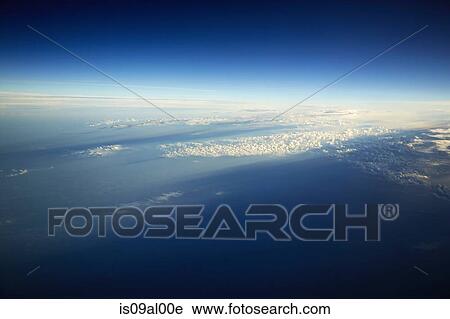 Aerial view over landscape with clouds View Large Photo Image Stock Image - Aerial view over landscape with clouds. Fotosearch