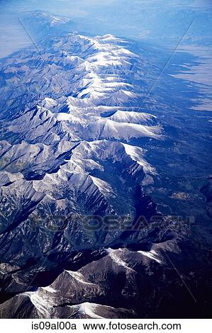 Aerial view over mountains View Large Photo Image Stock Image - Aerial view over mountains. Fotosearch