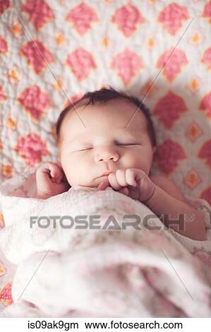 Picture - Baby girl sleeping. Fotosearch