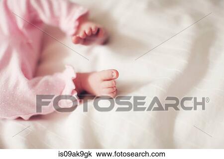 Stock Image - Baby girl's legs. Fotosearch