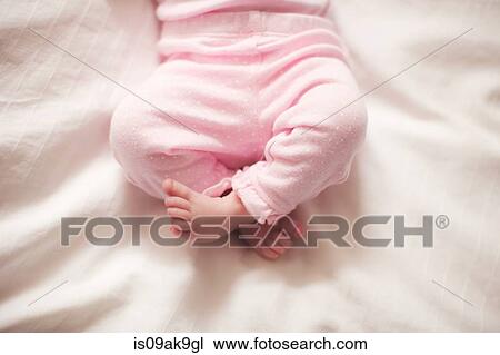 Stock Image - Baby girl's legs. Fotosearch
