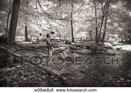 Black and white of mid adult father and baby daughter fishing in forest river View Large Photo Image Stock Photograph - Black and white of mid adult father and baby daughter fishing in forest river. Fotosearch