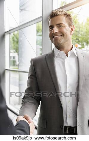 Businessmen shaking hands View Large Photo Image Stock Image - Businessmen shaking hands. Fotosearch