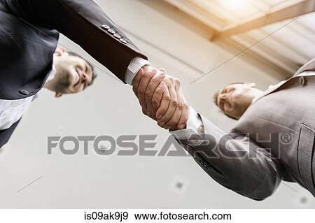 Stock Photo - Businessmen shaking hands. Fotosearch