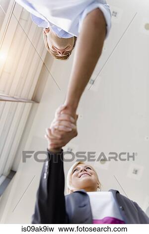 Businesswoman and businessman shaking hands View Large Photo Image Stock Photo - Businesswoman and businessman shaking hands. Fotosearch