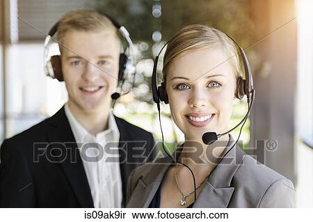 Call centre team wearing headsets View Large Photo Image Stock Photography - Call centre team wearing headsets. Fotosearch
