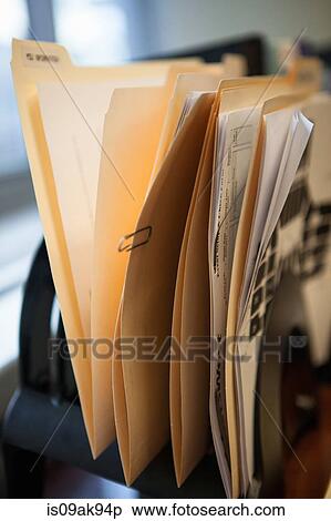 Close up of inbox row of files on office desk View Large Photo Image Stock Photography - Close up of inbox row of files on office desk. Fotosearch
