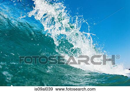 Close up of rolling wave splashing View Large Photo Image Stock Photo - Close up of rolling wave splashing. Fotosearch