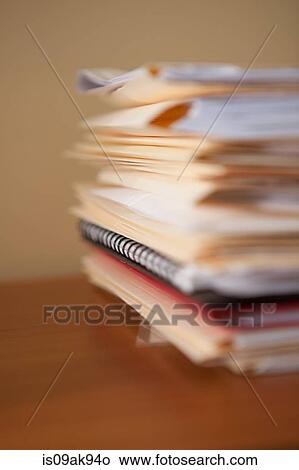 Close up of stack of paperwork and files on office desk View Large Photo Image Picture - Close up of stack of paperwork and files on office desk. Fotosearch