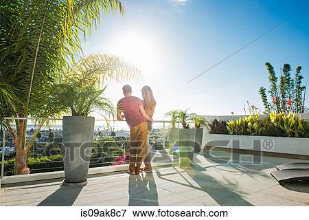 Couple looking at view from penthouse rooftop garden, La Jolla, California, USA View Large Photo Image Stock Photo - Couple looking at view from penthouse rooftop garden, La Jolla, California, USA. Fotosearch