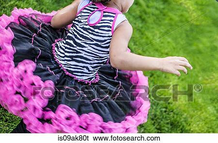 Cropped rear view of girl running in frilly party dress View Large Photo Image Stock Photograph - Cropped rear view of girl running in frilly party dress. Fotosearch