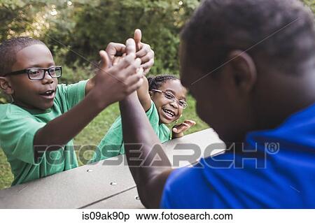 Father arm wrestling with son and daughter at parkland eco camp View Large Photo Image Stock Photography - Father arm wrestling with son and daughter at parkland eco camp. Fotosearch