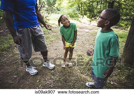 Father with daughter and son in forest eco camp View Large Photo Image Stock Photo - Father with daughter and son in forest eco camp. Fotosearch