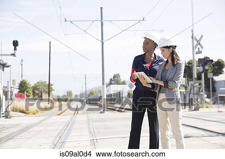 Female architects with digital tablet View Large Photo Image Picture - Female architects with digital tablet. Fotosearch
