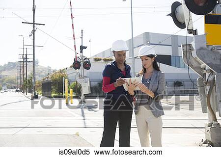 Female architects with digital tablet View Large Photo Image Stock Photography - Female architects with digital tablet. Fotosearch