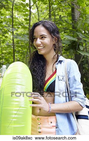 Hiker in forest with inflatable ring View Large Photo Image Stock Image - Hiker in forest with inflatable ring. Fotosearch