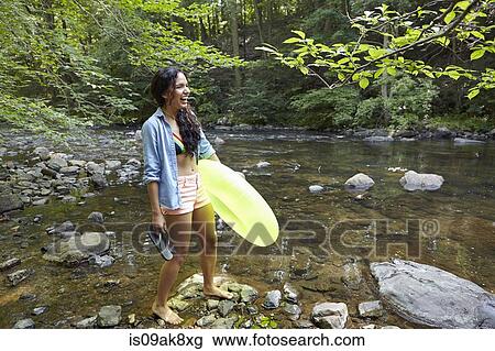 Hiker in forest with inflatable ring View Large Photo Image Stock Image - Hiker in forest with inflatable ring. Fotosearch