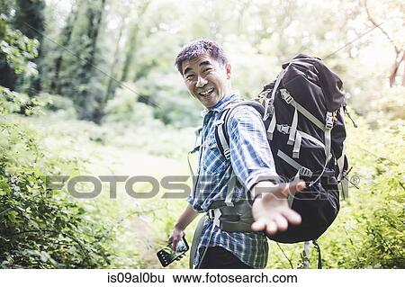 Hiker reaching hand toward camera View Large Photo Image Stock Photograph - Hiker reaching hand toward camera. Fotosearch