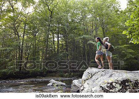 Hikers in forest View Large Photo Image Picture - Hikers in forest. Fotosearch