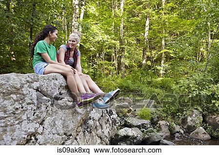 Stock Photography - Hikers in forest. Fotosearch