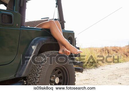 Legs of young woman resting over jeep window, Malibu, California, USA View Large Photo Image Stock Photography - Legs of young woman resting over jeep window, Malibu, California, USA. Fotosearch