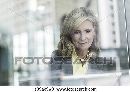 Mature businesswoman with blonde hair, portrait View Large Photo Image Stock Image - Mature businesswoman with blonde hair, portrait. Fotosearch