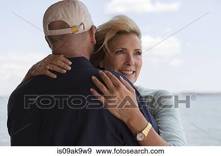 Stock Photo - Mature couple hugging. Fotosearch