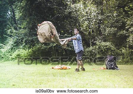 Mature man putting up tent View Large Photo Image Stock Photo - Mature man putting up tent. Fotosearch